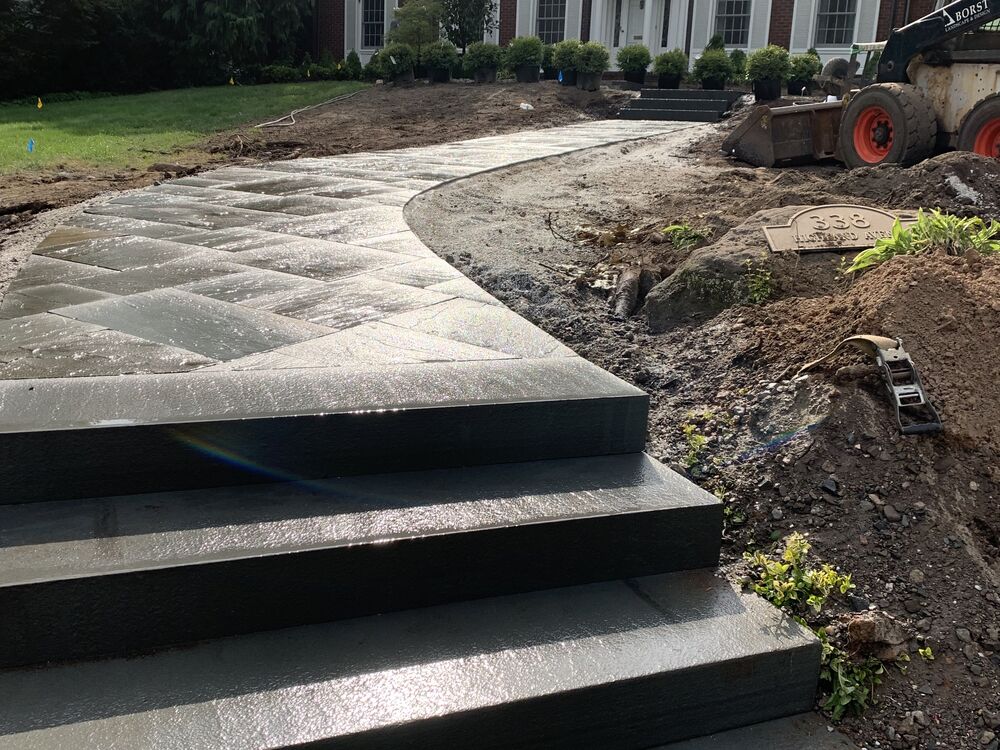 Black bluestone walkway and steps under construction